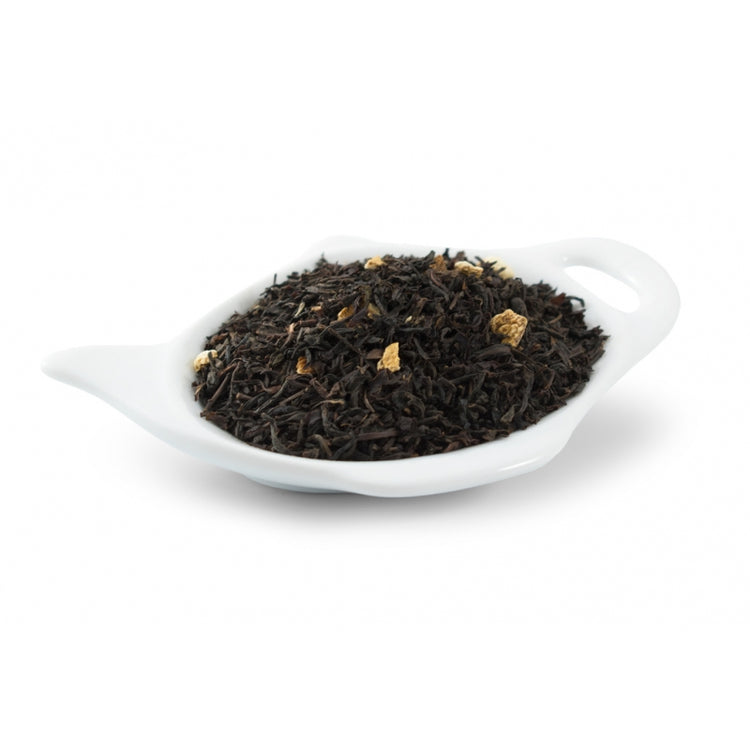 svart te Te med smak av kvittenäpple och med citrusskal.